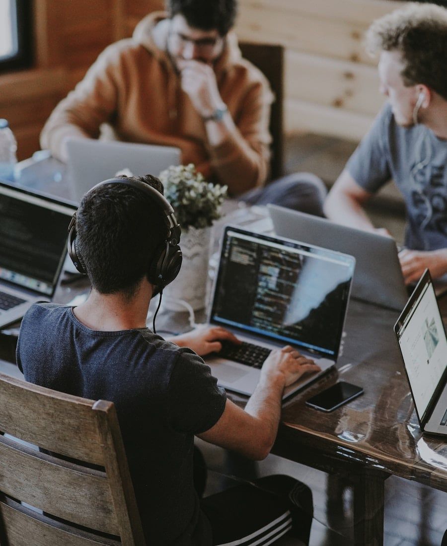 Tired of generic agency SEO? — LoudCrowd strategy team collaborating around a laptop
